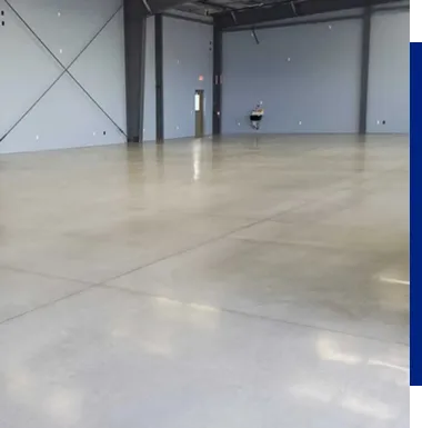 Empty industrial warehouse with polished concrete floor