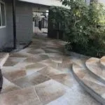 Flagstone patio walkway with curved steps