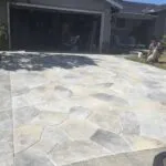 New stone-pattern driveway in front of garage
