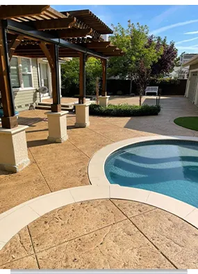 Backyard patio with swimming pool and pergola