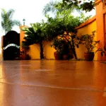 Sunlit tiled patio with potted plants