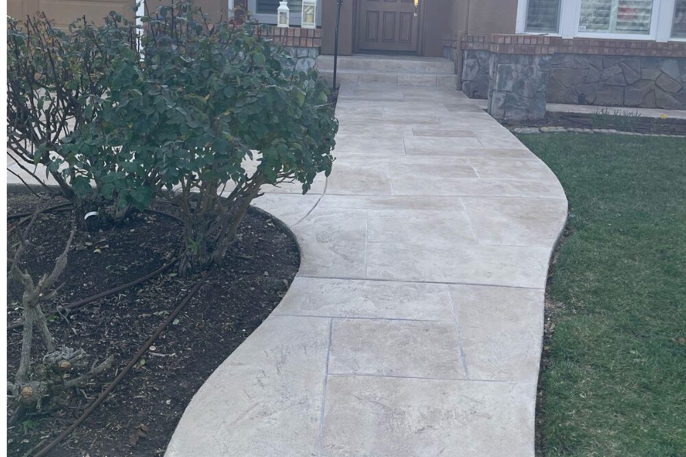 Curved concrete walkway leading to front door